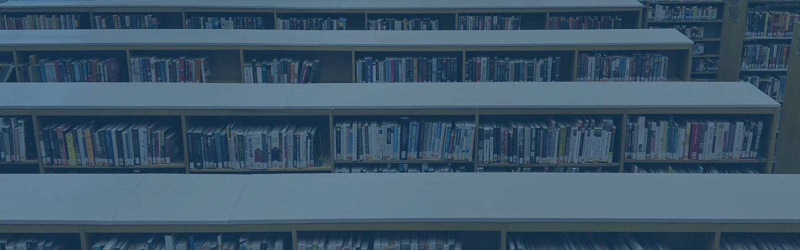 Rows of metal bookshelves filled with library books