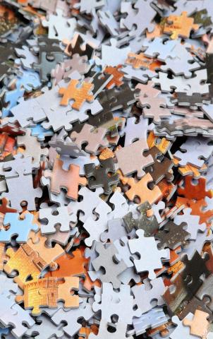 A jumble of assortd puzzle pieces